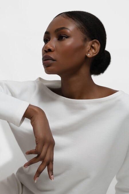 yae; Debuts on Wolf & Badger With a Sharply Edited Wardrobe of Essentials Minimal womenswear essentials in dark chocolate, coffee and cream tones arranged in a refined studio setting