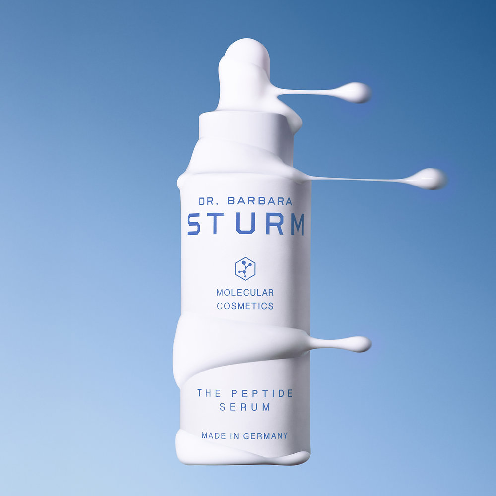 Dr. Barbara Sturm’s Travel Skincare Edit Is Built for Skin in Motion Dr. Barbara Sturm travel skincare essentials arranged with cleanser, creams and serums for a refined travel routine