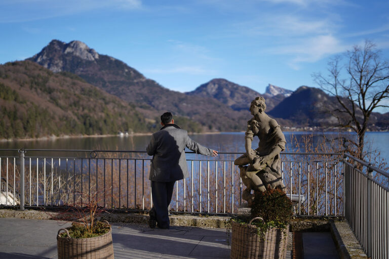 Winter Without the Noise with Abdelaziz Alsafady at Rosewood Vienna and Schloss Fuschl Winter view of Rosewood Schloss Fuschl beside the calm waters of Fuschlsee in Austria