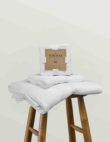 Natural bamboo, hemp and mulberry silk bedding arranged on a calm neutral bed