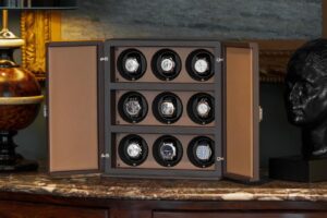 Selection of luxury watch winders displayed with automatic watches