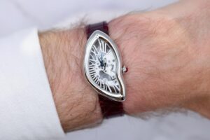 Cartier Privé Crash Squelette Platinum Review: The Crash Becomes Architecture Cartier Privé Crash Squelette platinum watch with skeleton Roman numeral bridges on burgundy alligator strap