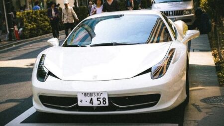A 242,000-Mile Ferrari 458 Italia Shows What Supercars Can Really Do Ferrari 458 Italia driving on a wet road in Japan