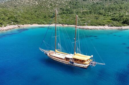 Turkey’s Turquoise Coast by Private Yacht Reveals a Quieter Side of the Aegean Traditional wooden gulet anchored in a secluded turquoise bay on Turkey’s southwestern coast