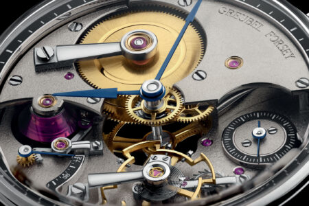 Close-up of a decorated mechanical watch movement with Geneva stripes and engraved details