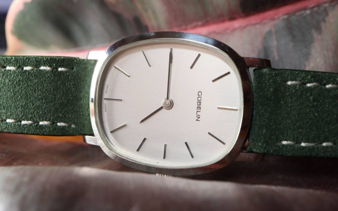Vintage Gübelin Ellipse-style dress watch with a slim gold-tone case and simple dial