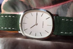 The Gübelin Ellipse: A Slim, Obscure Link Between Retailer-Signed Watches and 1970s Dress Design Vintage Gübelin Ellipse-style dress watch with a slim gold-tone case and simple dial