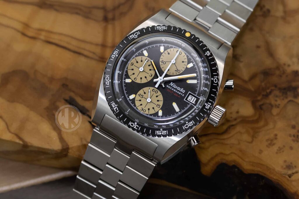 Nivada Grenchen Autochron MecaQuartz with black dial, tan subdials and stainless steel bracelet