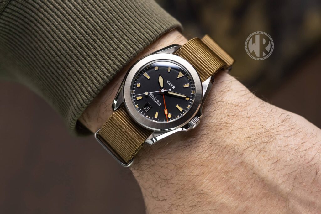 Vaer G2 Apocalypse GMT on a strap with matte black dial and fixed brushed steel bezel