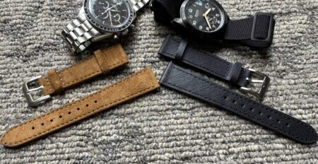 Helvetus Watch Straps Bring New Life to the Speedmaster FOIS and Bremont Broadsword Jet Omega Speedmaster FOIS on a brown suede Helvetus strap beside a Bremont Broadsword Jet on a black leather strap