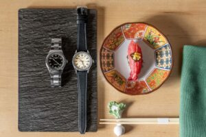 Omakase sushi counter with a chef preparing nigiri in a quiet Japanese dining setting