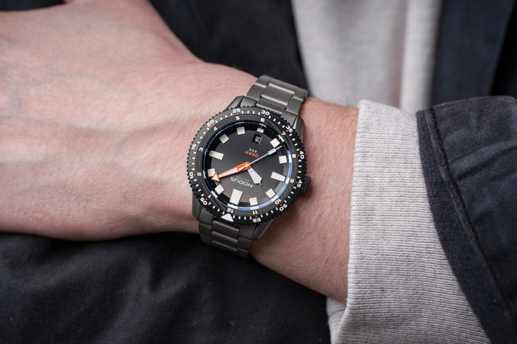 Nodus Gives the Sector Deep a Damascus Bezel and a Longer Running Movement Nodus Sector Deep Damascus dive watch with gunmetal DLC case and black Damascus bezel