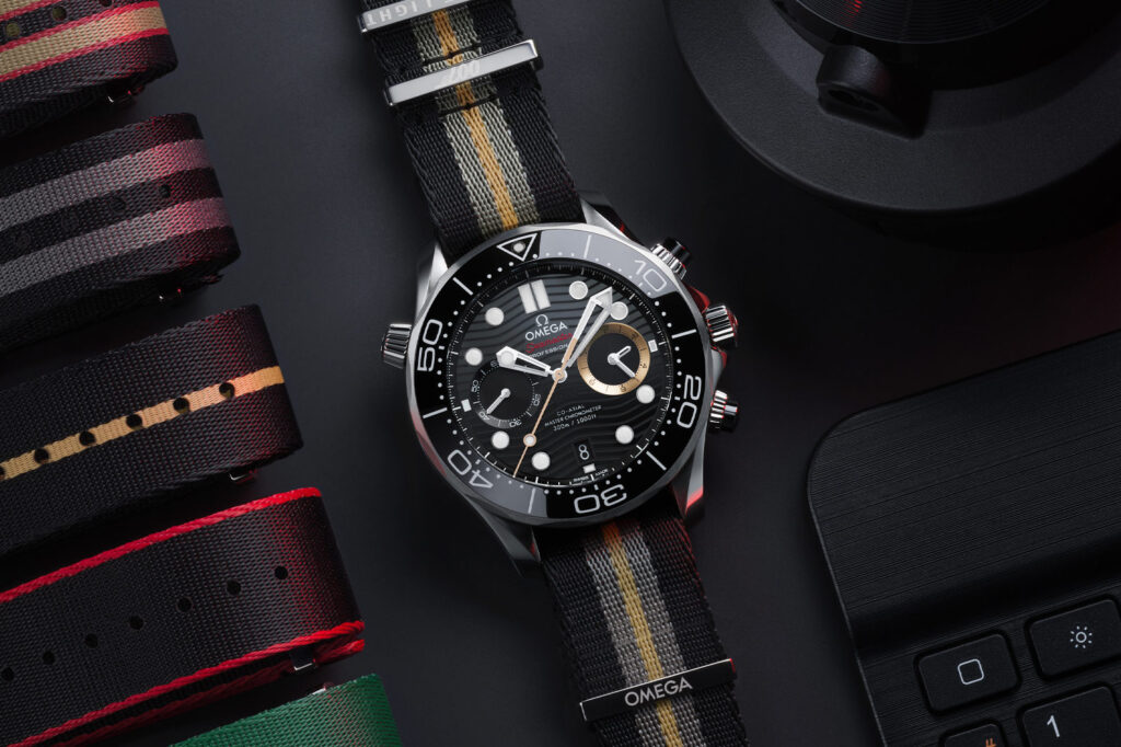 Omega Brings 007 First Light To The Seamaster Diver 300M Chronograph Omega Seamaster Diver 300M Chronograph 007 First Light on NATO strap with black ceramic wave dial