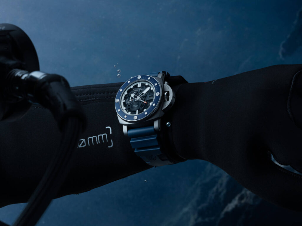 Panerai’s Submersible GMT PAM01495 Brings 3D-Printed Titanium to 500 Metres Panerai Submersible GMT PAM01495 in sandblasted titanium with blue bezel and skeletonised dial