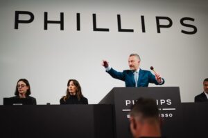 Phillips Geneva XXIII Sets a New Benchmark for Watch Auctions Auction room during a major Geneva watch sale with collectors bidding on rare Patek Philippe and independent watches
