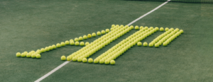 Audemars Piguet Brings Haute Horlogerie Onto the Padel Court A luxury padel court with a visible tournament clock and players in action