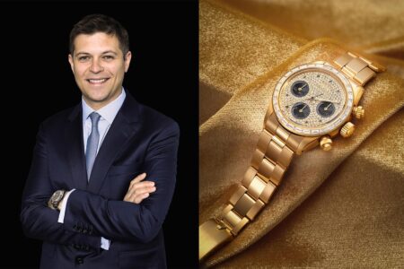 Sam Hines style watch auction scene with rare vintage watches displayed in a Hong Kong saleroom