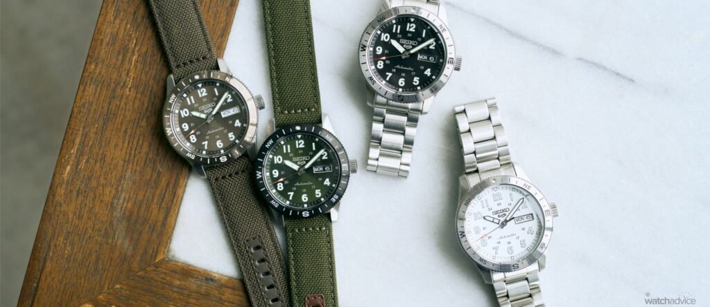 Four Seiko 5 Sports Field Compass watches in black, white, green and brown