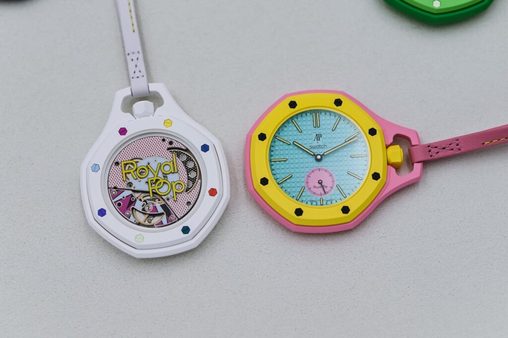 Selection of pendant, pocket and transforming watches arranged as a modern horological still life