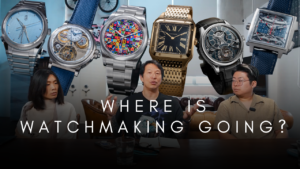 Visitors at Watches and Wonders 2026 viewing new luxury watches in a modern exhibition setting