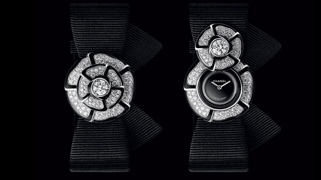 Chanel Nœud de Camélia Turns the House Flower Into a Secret Watch Chanel Nœud de Camélia diamond secret watch with camellia flower cover on black strap