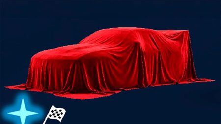 Shadowy Dodge muscle car teaser with a massive rear wing and wide fenders