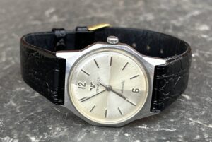 Vintage Seiko Turtle, Longines Comet and Grand Seiko watches arranged together