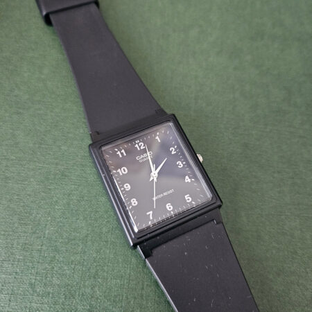 Casio MQ-27-1B black rectangular analog watch on a black strap