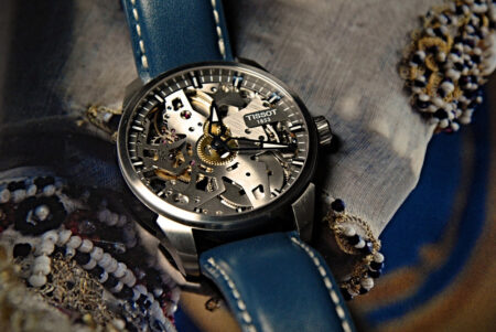 A curated watch collection being reduced, with a Rolex Explorer II and other watches on a table