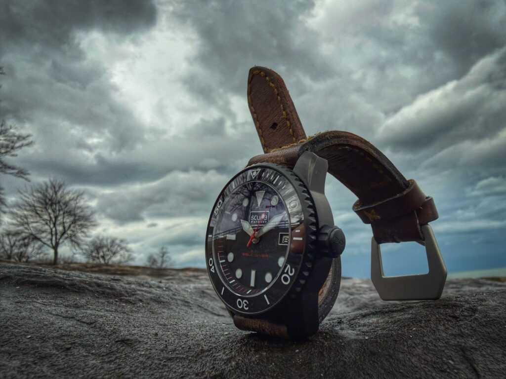 Scurfa Bell Diver 1 PVD black dive watch on wrist with lumed bezel and red seconds hand