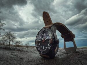 Scurfa Bell Diver 1 PVD black dive watch on wrist with lumed bezel and red seconds hand