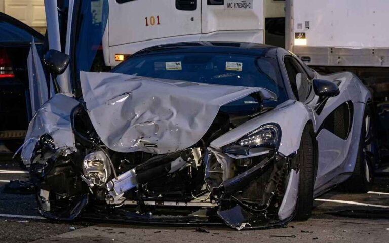 Fatal McLaren Collision in Chicago Puts Late Night Speed Under Scrutiny Police lights at a nighttime urban intersection after a serious crash in Chicago