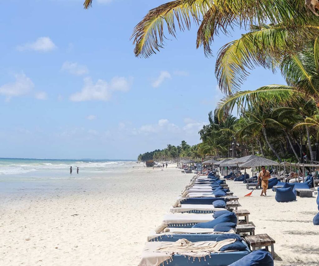 Tulum and Valladolid Are the Yucatan Pairing That Gets Mexico Right Colorful colonial street in Valladolid with tropical plants and bright Yucatan architecture
