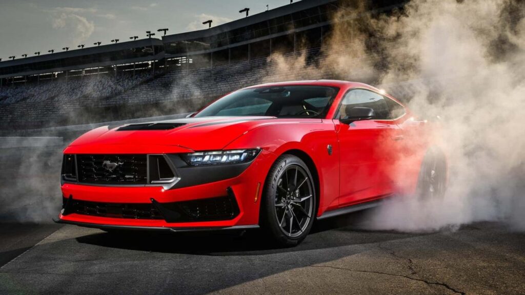 A Four-Door Ford Mustang With V8 Power Is Starting to Sound Possible Concept-style front three-quarter view of a four-door Ford Mustang-inspired performance sedan