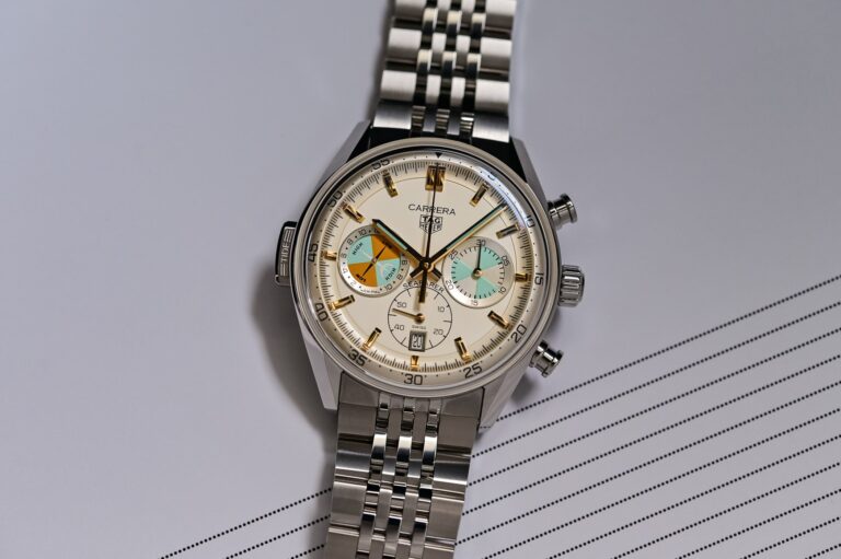 Five Summer Watches Built for Beach Days, Boats and Trail Time Selection of summer-ready wristwatches on a beach towel near sunglasses and sea water