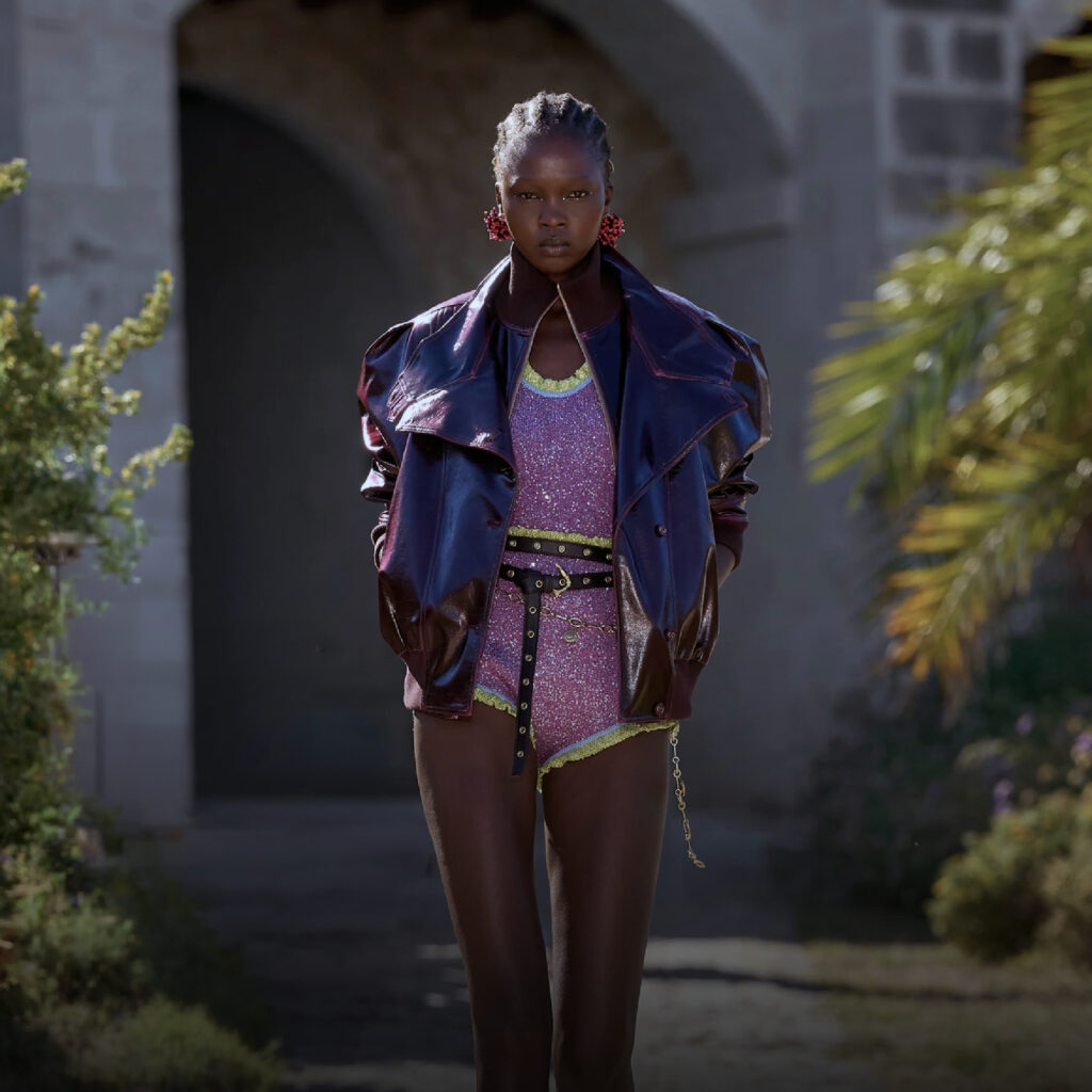 Alémais Resort 2027 Brings an Artful Mediterranean Ease to Summer Dressing Alémais Resort 2027 runway presentation on Illa del Rei in Menorca with colourful Mediterranean-inspired looks