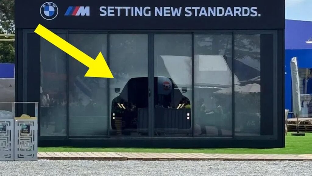 BMW’s Electric M3 Looks Set for a Le Mans Weekend Reveal BMW electric M3 display at the Le Mans race weekend fan zone
