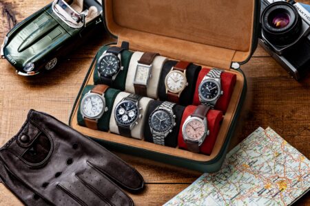 Luxury watch cases arranged on a dressing table with watches inside
