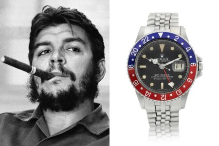 Vintage Rolex watches with Cold War era political documents on a desk