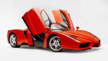 Rosso Dino Ferrari Enzo Sets a New Online Auction Record Ferrari Enzo in Rosso Dino shown as a rare collector supercar