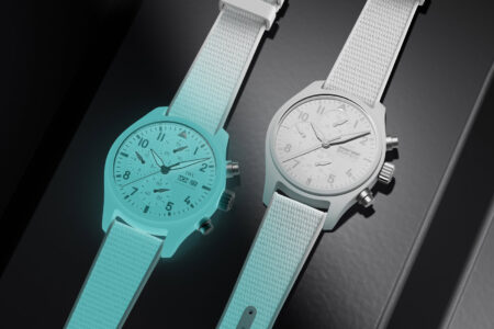 The 2026 Watch Innovations Worth Taking Seriously A modern watchmaker’s bench with glowing ceramic, sapphire and mechanical chronograph components