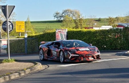 Red Lamborghini Revuelto SV with aggressive aero at Monterey Car Week