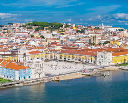 Lisbon Still Has Europe’s Most Seductive Slow Burn Lisbon rooftops and the Tagus River at sunset