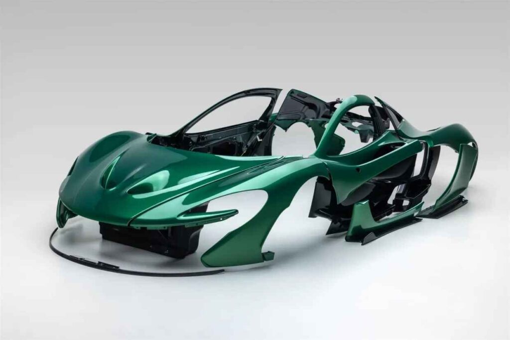 McLaren P1 bodywork from Michael Fux’s hypercar heads to auction Metallic green McLaren P1 body panels with exposed carbon fibre accents in a shipping crate