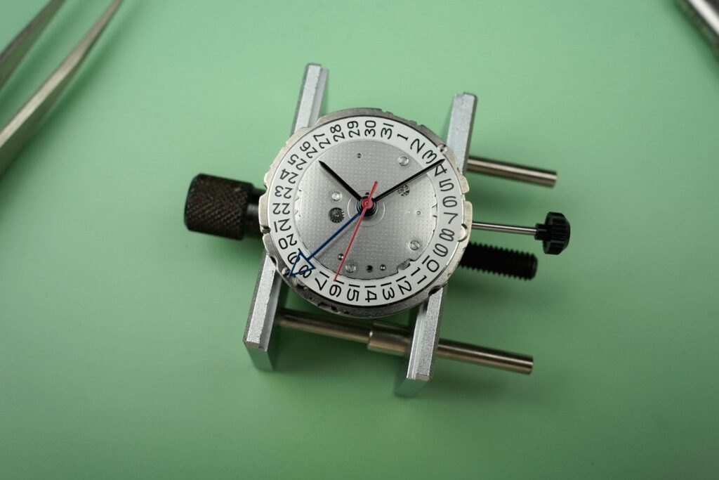 Miyota Calibre 9075 automatic true GMT movement with rotor and dial-side components visible