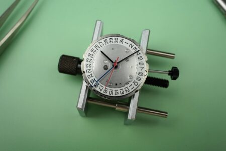 Miyota’s Calibre 9075 Shows Why True GMT Movements Matter Miyota Calibre 9075 automatic true GMT movement with rotor and dial-side components visible