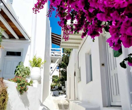 What Villa Platforms Won’t Tell You About Renting in Mykonos Whitewashed luxury villa with pool overlooking the sea in Mykonos