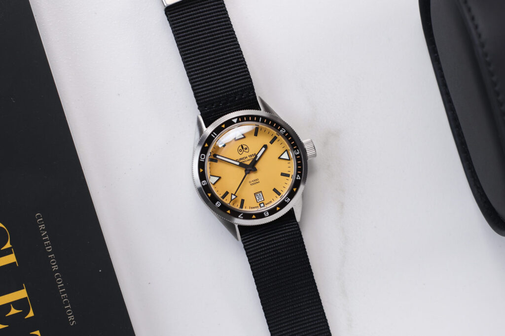 Ollech & Wajs C-1000 Y Makes the 1,000m Diver Wearable Ollech & Wajs C-1000 Y yellow dial dive watch on a black nylon strap