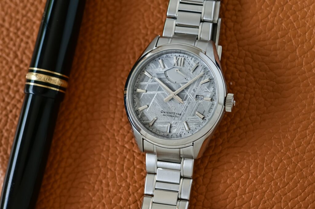 Orient Star Gives the M34 F8 Date a Meteorite Dial for Its 75th Anniversary Orient Star M34 F8 Date Meteorite 75th Anniversary Limited Edition watch with silver-grey meteorite dial