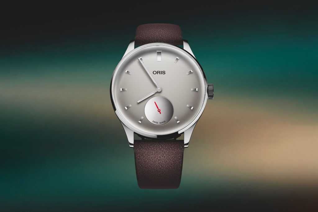 Oris Marks Its 122nd Birthday With the Hölstein Edition 2026 Artelier Oris Hölstein Edition 2026 Artelier Small Seconds with grey dial and suede strap